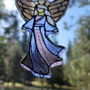 Handcrafted Guardian Angel suncatcher made with cremation ash, featuring stained glass angel wings and flowing robes with a hanging crystal accent, designed to catch and reflect natural light.