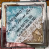 Personalized Oceanside Ring Dish with Cremation Ash featuring a square clear glass memorial dish with engraved name and dates, ocean wave design, sandy shoreline, and embedded seashells