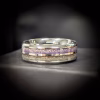 Dual Channel Cremation Ring with purple and clear memorial glass inlays, shown on a dark surface in a studio close-up view