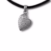 Silver heart-shaped cremation pendant covered in a clustered floral-style pattern of sparkling stones, with a larger round gemstone near the top, shown hanging from a black cord.