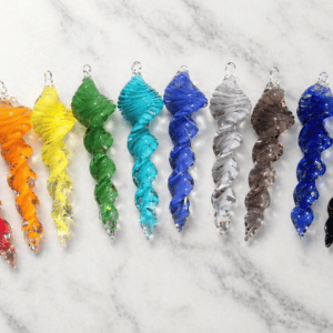 Colorful cremation art glass spinners with rainbow hues and embedded ashes.