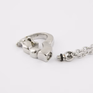 Silver cat-shaped cremation pendant shown open with removable screw for ashes