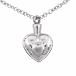 Silver Claddagh cremation necklace with heart, hands, and crown design on stainless steel pendant