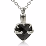 Obsidian Heart Cremation Necklace shown from the front, featuring a faceted black heart-shaped stone held by silver claw-style prongs and attached to a silver chain.