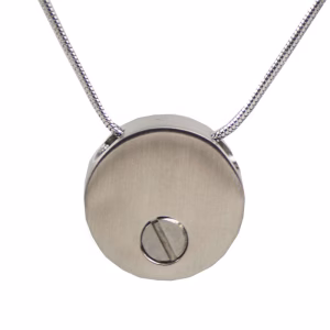 Backside view of the Paw Prints Cremation Necklace in pewter featuring a circular brushed-metal finish and a recessed screw for securing ashes.
