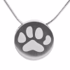 Close-up view of a round pewter cremation necklace featuring a large engraved paw print, shown on a silver snake chain against a white background.