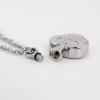 Silver Claddagh cremation necklace with threaded ash compartment shown opened