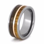 Angled view of tungsten memorial ring with rowan wood inlay, rose gold center channel, and preserved pet fur on white background