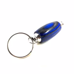 Hearthwood urn pendant shown in royal blue and charcoal laminate wood with silver metal key ring attached on white background