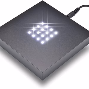 A square light display pedestal with 16 bright white LED lights.