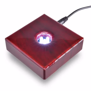 A cherry wood light base with 5 white LED lights in the middle.