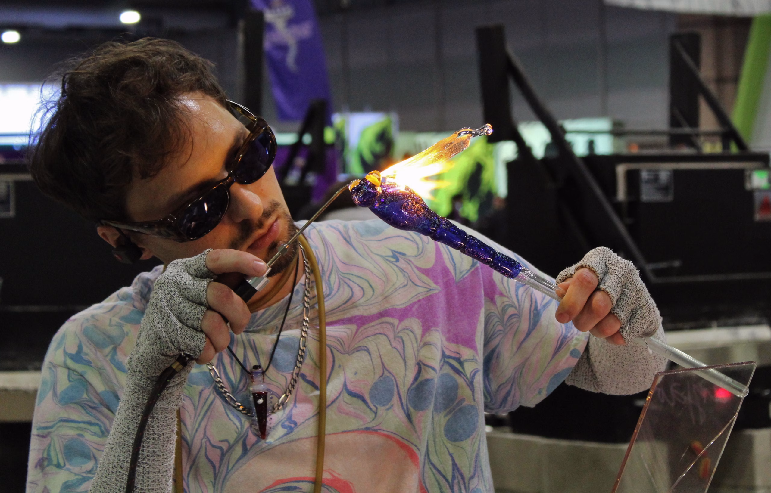 Memorial artist Greg creating a glass dragonfly in the studio, showcasing careful detail and craftsmanship