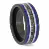 Angled side view of black ceramic memorial ring with blue enamel pinstripes and titanium inlay band containing cremation ashes.