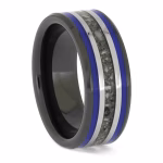 Angled side view of black ceramic memorial ring with blue enamel pinstripes and titanium inlay band containing cremation ashes.