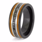 Angled view of black ceramic memorial ring with orange enamel pinstripes and titanium inlay band containing cremation ashes.