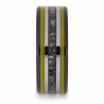Straight-on view of black ceramic memorial ring with yellow enamel pinstripes and titanium inlay band containing cremation ashes.