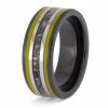 Angled view of black ceramic memorial ring with yellow enamel pinstripes and titanium inlay band containing cremation ashes.