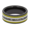 Top view of black ceramic memorial ring with yellow enamel pinstripes and titanium inlay band containing cremation ashes.