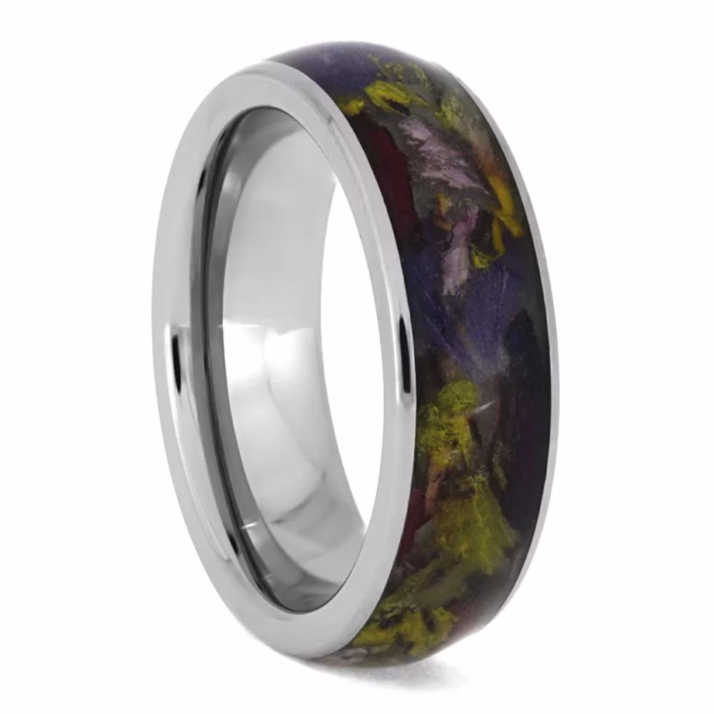 Flower Petal Ring in Titanium shown in angled view with multicolored dried flower petals preserved inside the center inlay