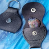 Functional Glass Guitar Pick with Cremation Ash shown with black snap-closure keychain pouch open and closed