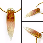 Composite image showing multiple views of a solid glass crystal cremation pendant with visible cremation ashes inside, featuring a clear-to-amber gradient created with pure gold fume and suspended from a gold snake chain.