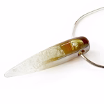 Straight-on side view of a solid glass crystal cremation pendant featuring a clear-to-amber gradient created with pure silver fume, suspended from a silver snake chain for holding cremation ashes.