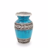 Turquoise and blue streaked keepsake urn with brushed metal floral band details around the center and lid, small memorial urn for holding a portion of cremation ashes.