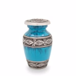 Turquoise and blue streaked keepsake urn with brushed metal floral band details around the center and lid, small memorial urn for holding a portion of cremation ashes.