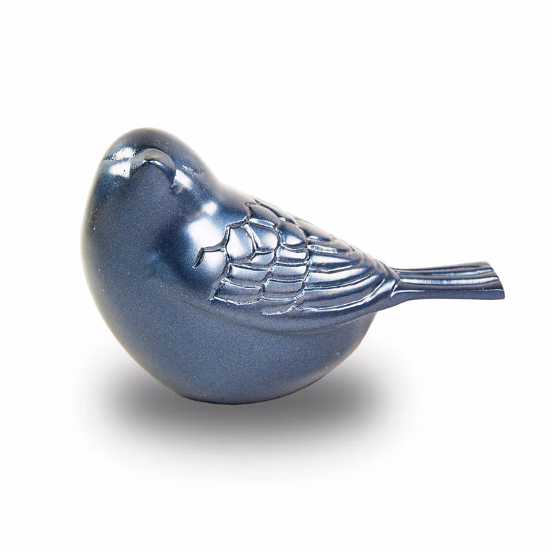 Frost Blue Songbird Keepsake Cremation Urn in a side profile view showing wing and tail feather detailing against a white background