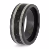 Angled view of black ceramic memorial ring with antler and cremation ash inlay