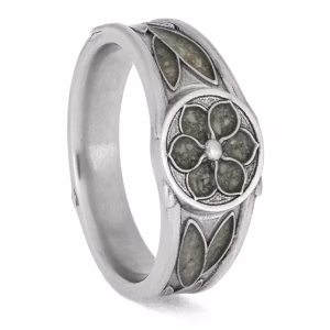 Angled view of memorial signet ring with floral design and cremation ash in platinum
