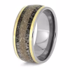 Angled view of titanium memorial ring with antler inlay, cremation ashes, and yellow gold accent