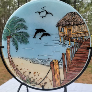 Beach Hut with Dolphins memorial glass suncatcher featuring ocean waves, palm tree, wooden pier, flying birds, and dolphins infused with cremation ash