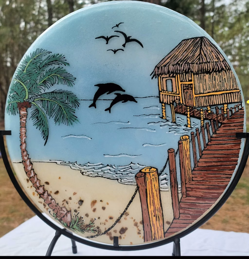 Beach Hut with Dolphins memorial glass suncatcher featuring ocean waves, palm tree, wooden pier, flying birds, and dolphins infused with cremation ash