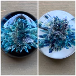 Comfort Stone with Cremation Ash shown in blue glass on black and white glass background for color comparison, by Sands of Time.