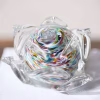 Memorial glass flower – handmade memorial glass flower with cremation ash suspended in a rainbow swirl, by Sands of Time.