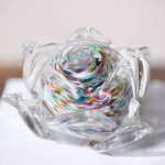 Memorial glass flower – handmade memorial glass flower with cremation ash suspended in a rainbow swirl, by Sands of Time.