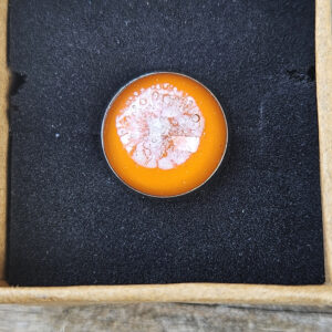 Memorial hat pin with cremation ashes in orange glass, handcrafted cremation jewelry by Sands of Time