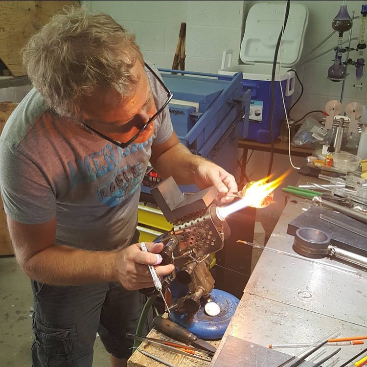 Artist creating a memorial piece in the studio, showcasing hands-on craftsmanship and respectful handling