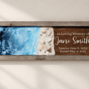 Small Oceanside Memorial with cremation ashes displayed on a minimalist neutral wall.