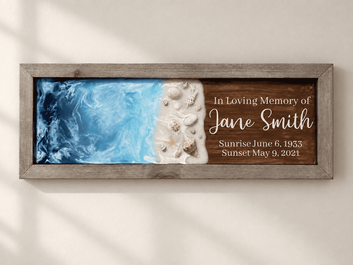 Small Oceanside Memorial with cremation ashes displayed on a minimalist neutral wall.
