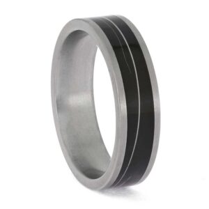 Upright angled view of matte titanium cat whisker memorial ring with preserved whisker inlay