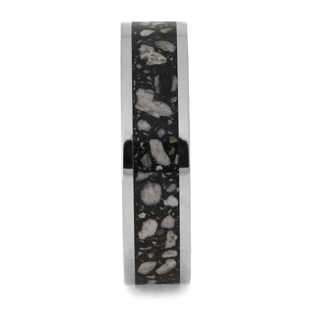 Titanium cremation ring layout with ashes and black enamel center inlay