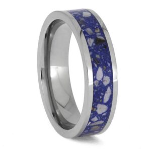Upright angled view of polished titanium cremation ring with ashes and blue enamel center inlay