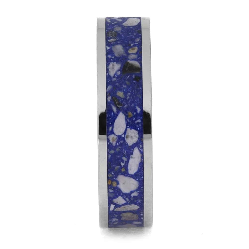 Titanium cremation ring layout with ashes and blue enamel center inlay