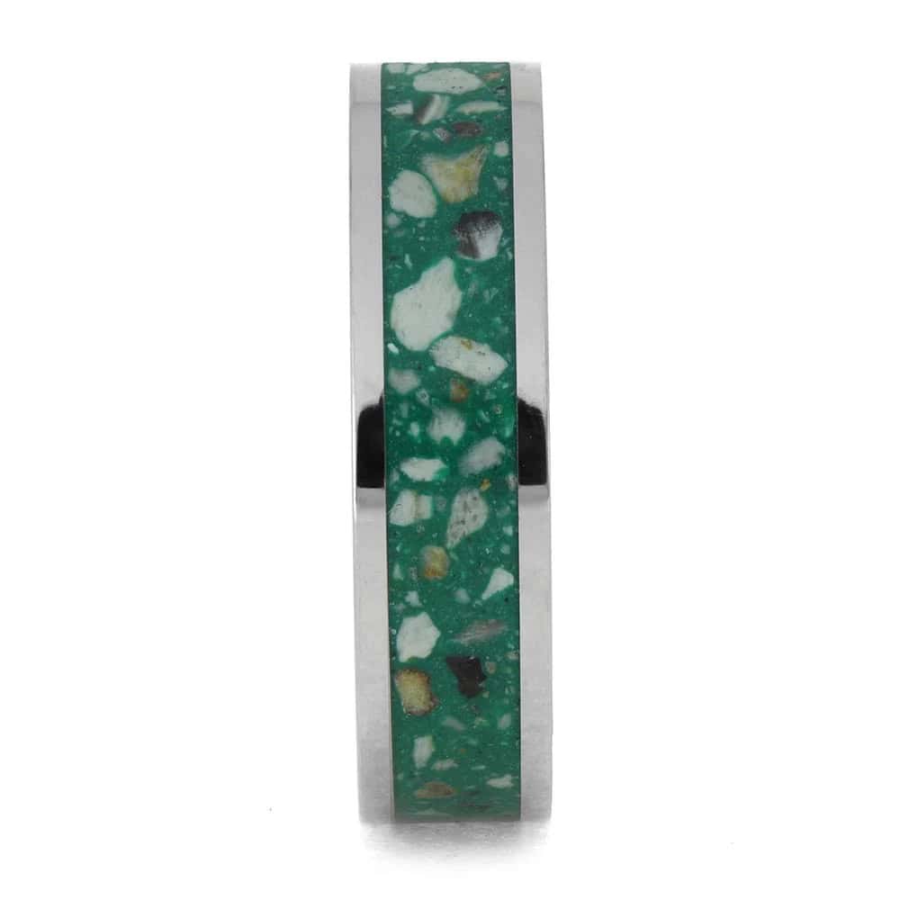 Titanium cremation ring layout with ashes and green enamel center inlay