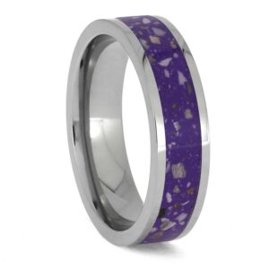 Upright angled view of titanium cremation ring with ashes preserved in a purple enamel center inlay