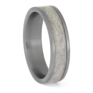 Upright angled view of matte titanium cremation ring with ashes and shimmering mica inlay
