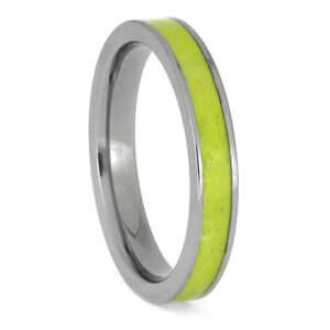 Upright angled view of titanium tennis ball memorial ring with bright green tennis ball center inlay